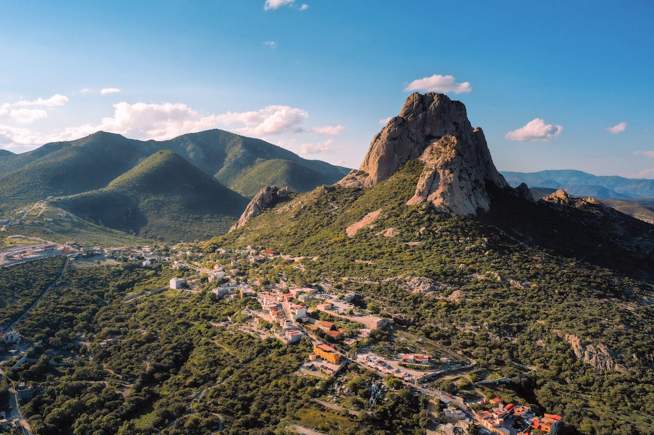 Breathtaking aerial shot of Peña de Bernal rock formation in Mexico.